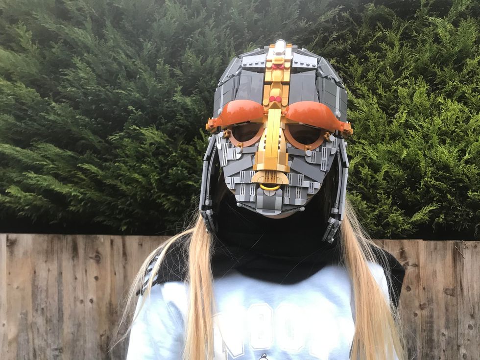 Matilda Webb in the Sutton Hoo Lego helmet CREDIT Andrew Webb