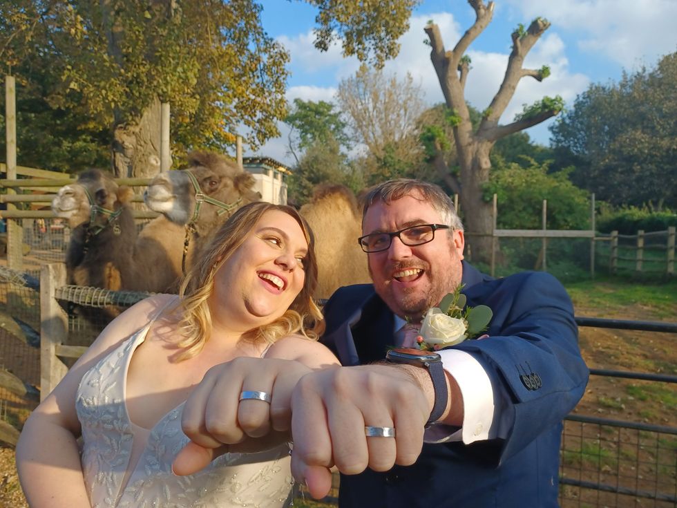 Matt Robbins (right), 39, and Alison Russell, 36, from Romford, Essex got married at London Zoo with a pair of special rings (Zoological Society of London)