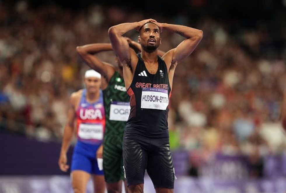 Matthew Hudson-Smith with his hands on his head looking up at the big screen in the Stade de France