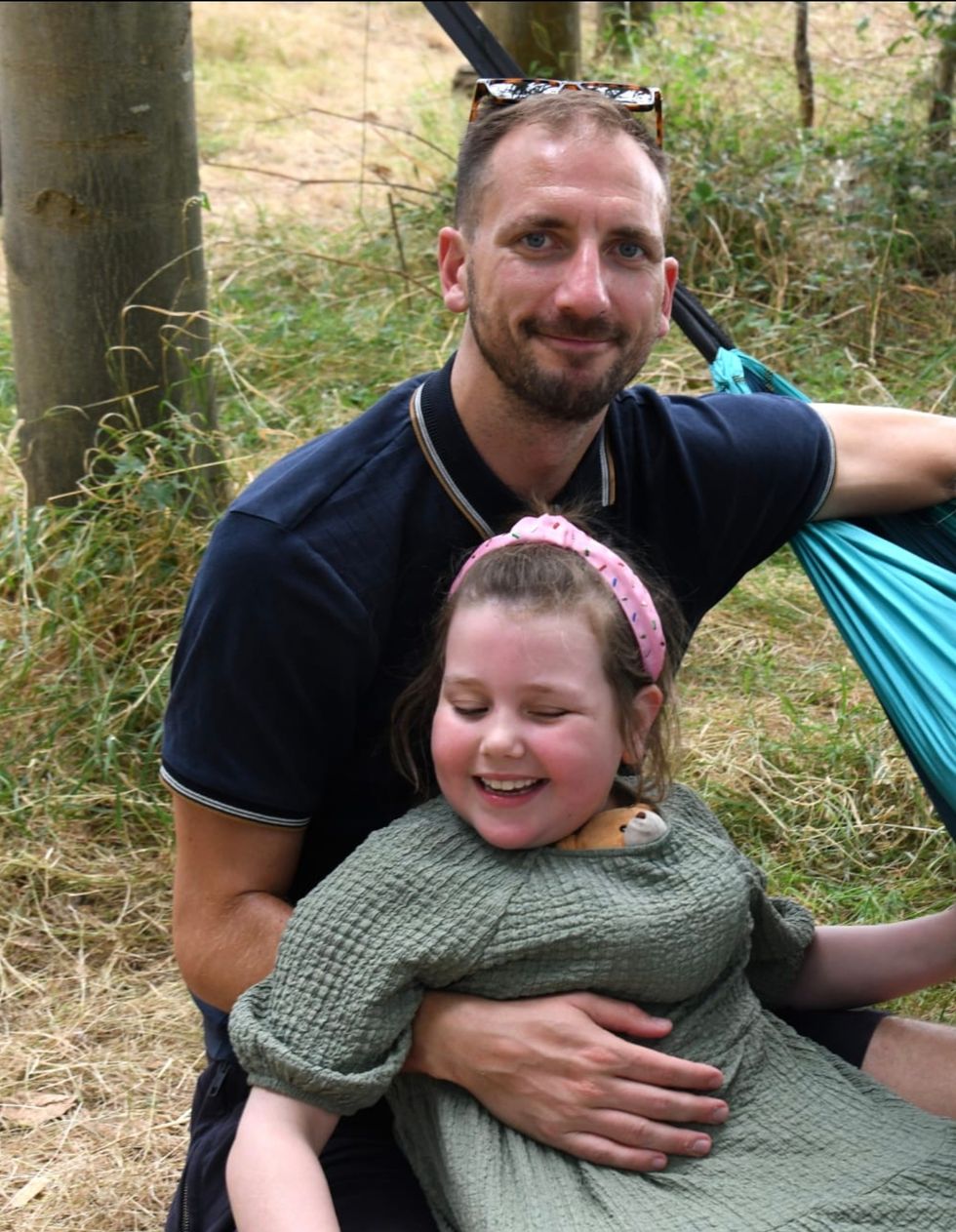 Matthew Taylor with his arm round his daughter Olivia
