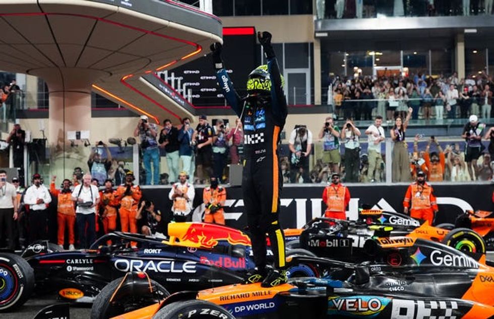 McLaren driver Lando Norris celebrates winning the Formula One world championship