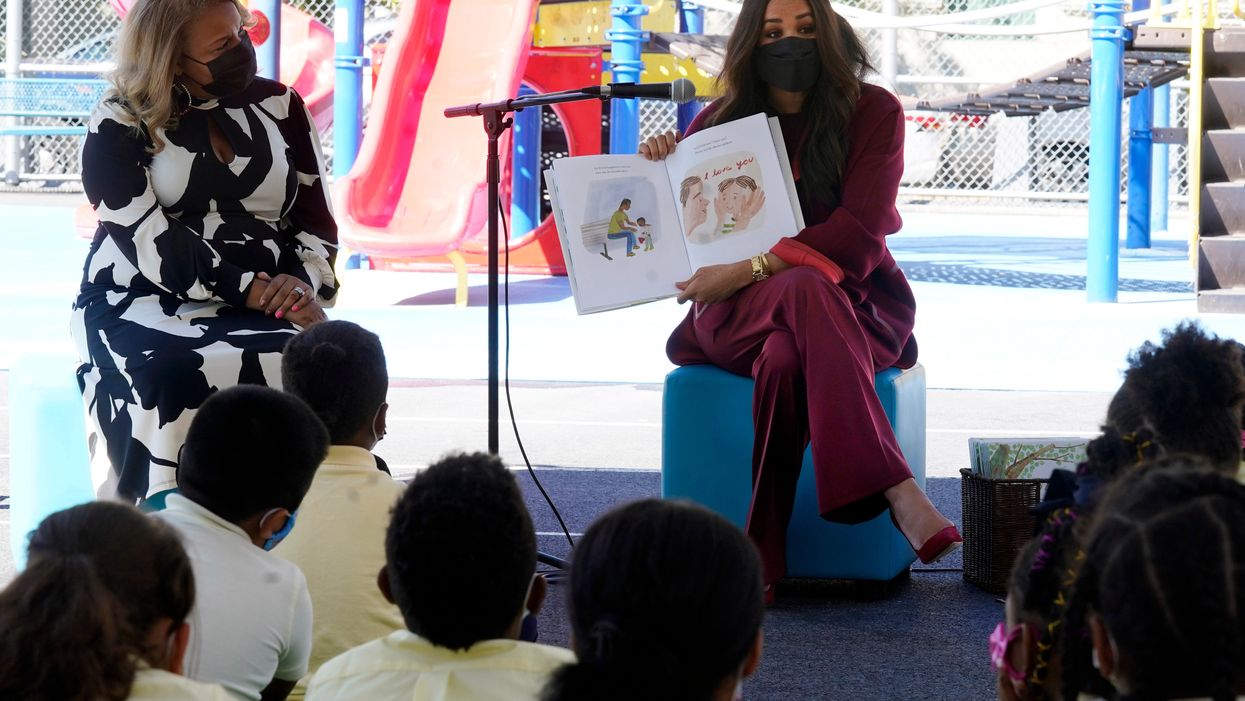 Meghan, the Duchess of Sussex, reads from her book The Bench during her visit with Prince Harry, to PS 123, the Mahalia Jackson School, in New York’s Harlem neighbourhood (Richard Drew/AP)