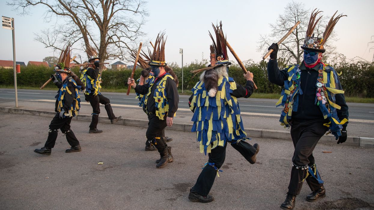 Members of the Hook Eagle Morris Men perform outside the Shack Cafe near to Hook in Hampshire