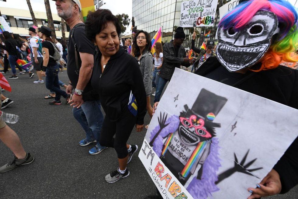 Members of the LGBT community and their supporters participate in the #ResistMarch at the 47th annual LA Pride Festival in Hollywood, California on June 11, 2017.