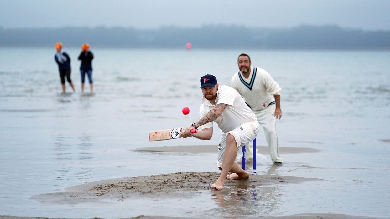 Members of the Royal Southern Yacht Club and the Island Sailing Club take part in the annual Brambles cricket match between the clubs (Andrew Matthews/PA)