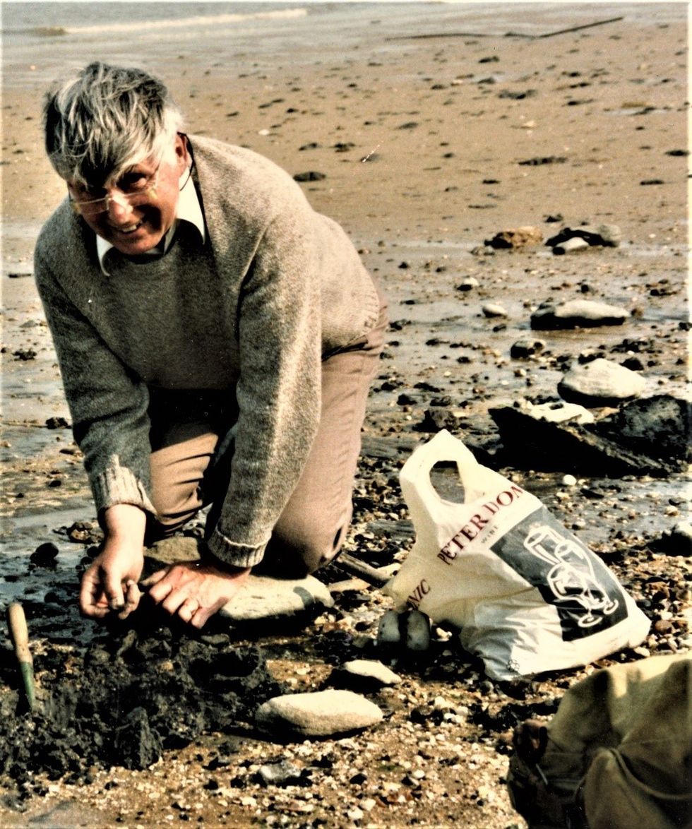 Michael Daniels with a fossil (Stewart Attwood/National Museums Scotland/PA)