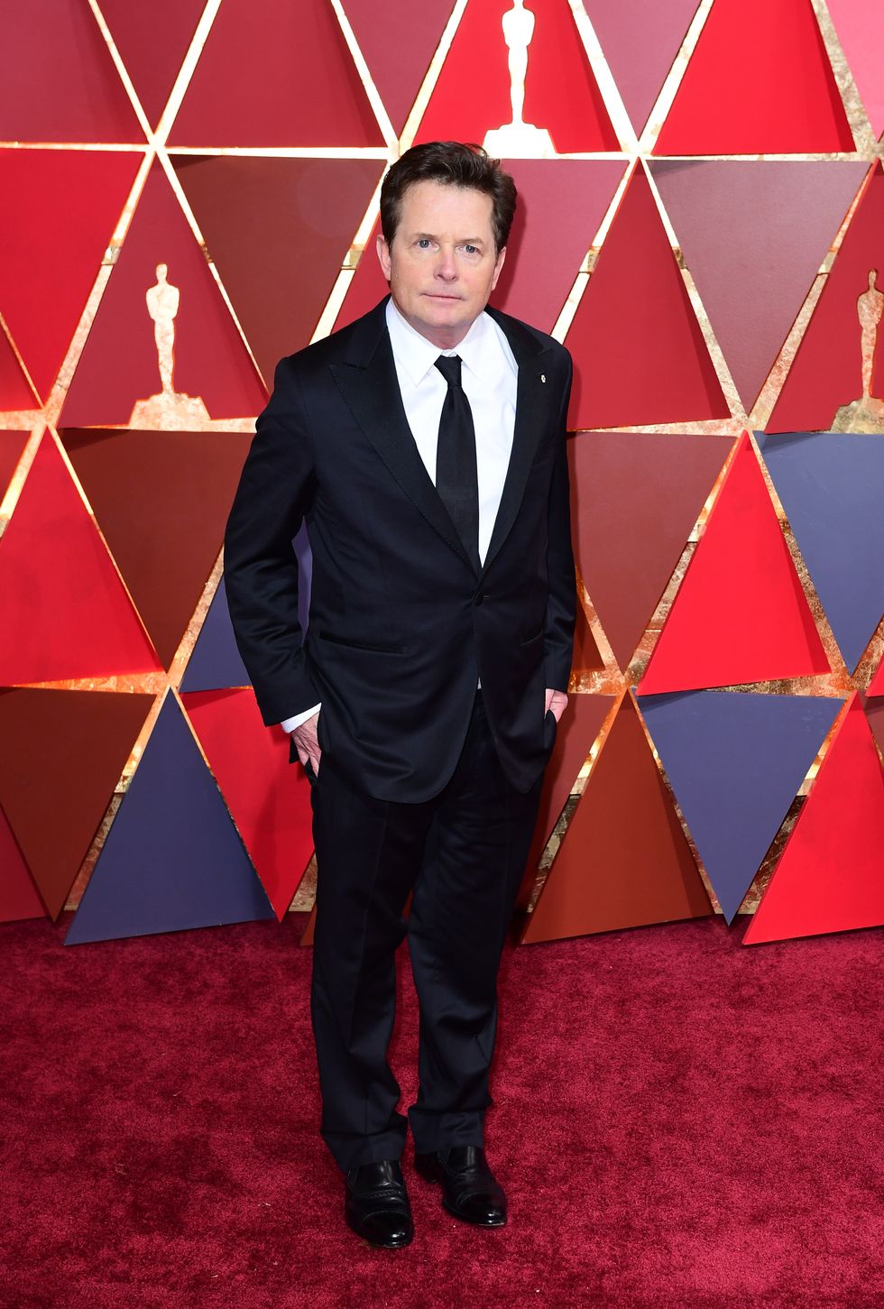 Michael J Fox given standing ovation after surprise appearance at Bafta awards