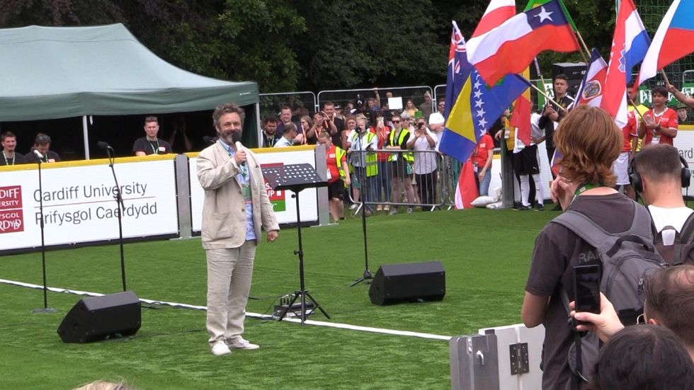 Michael Sheen delivers an address at the opening of the 2019 Homeless World Cup in Cardiff, Wales (Max McLean/PA)
