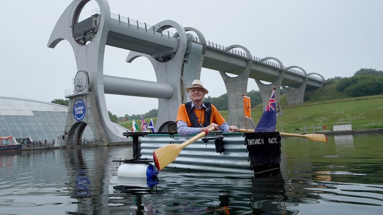 Michael Stanley, known as ‘Major Mick’, with his home-made boat ‘Tintanic II’ at the Falkirk Wheel (Andrew Milligan/PA)