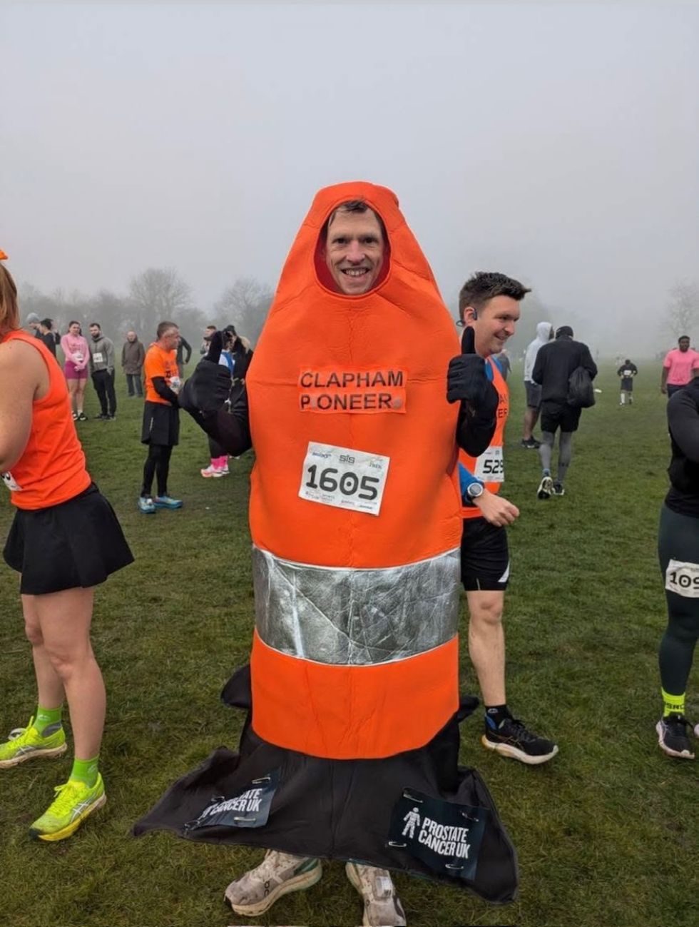 Runner aims to break record for fastest London Marathon run in traffic cone suit