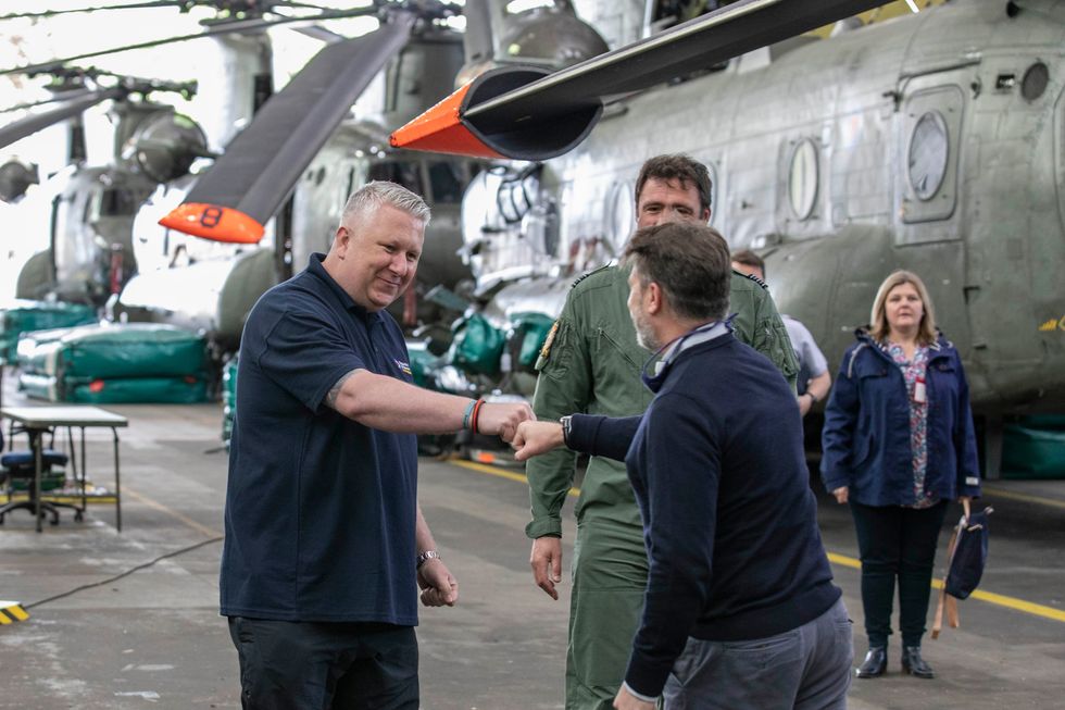 Mick McConnell, an ex RAF Police dog handler, at RAF Odiham to reunite him with the Chinook Crew that rescued him (Royal Air Force Benevolent Fund/PA)
