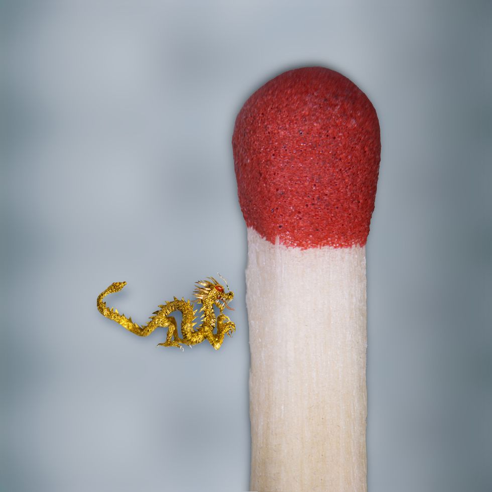 Sculptor creates tiny golden dragon smaller than a matchstick for Lunar New Year