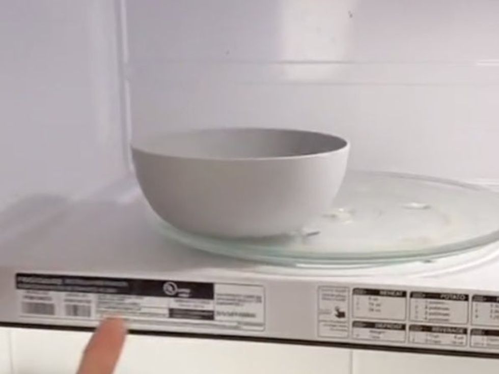 Microwaveable bowl on the edge of the rotating plate.