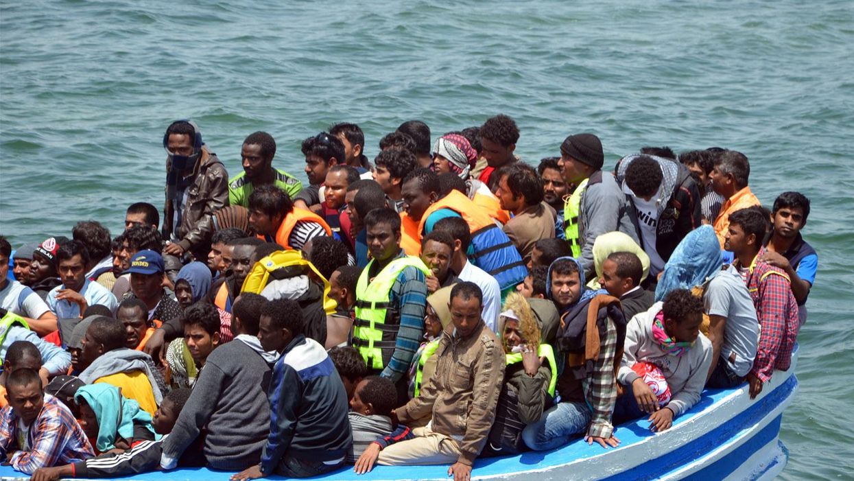 Migrants arrive at the port in the Tunisian town of Ben Guerdane, some 40 kilometres west of the Libyan border, following their rescue by Tunisia's coastguard and navy after their vessel overturned off Libya, on 10 June 2015.