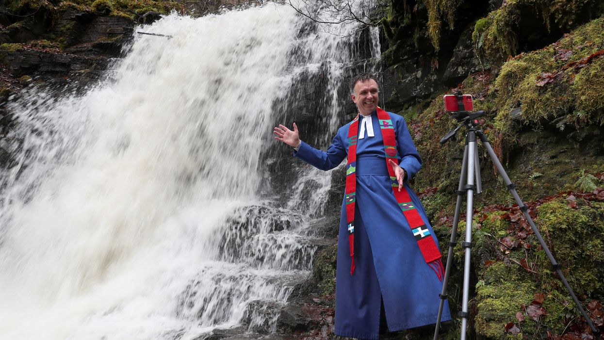 Minister at waterfall