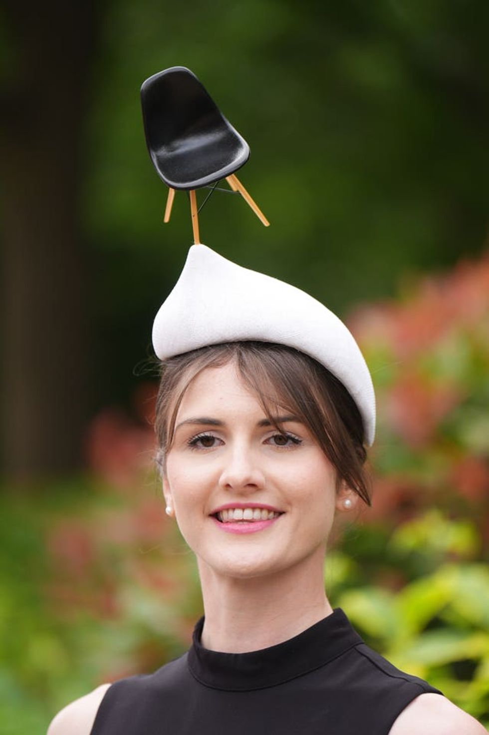 Model Laura wearing an unusual hat by Odette and Elliott