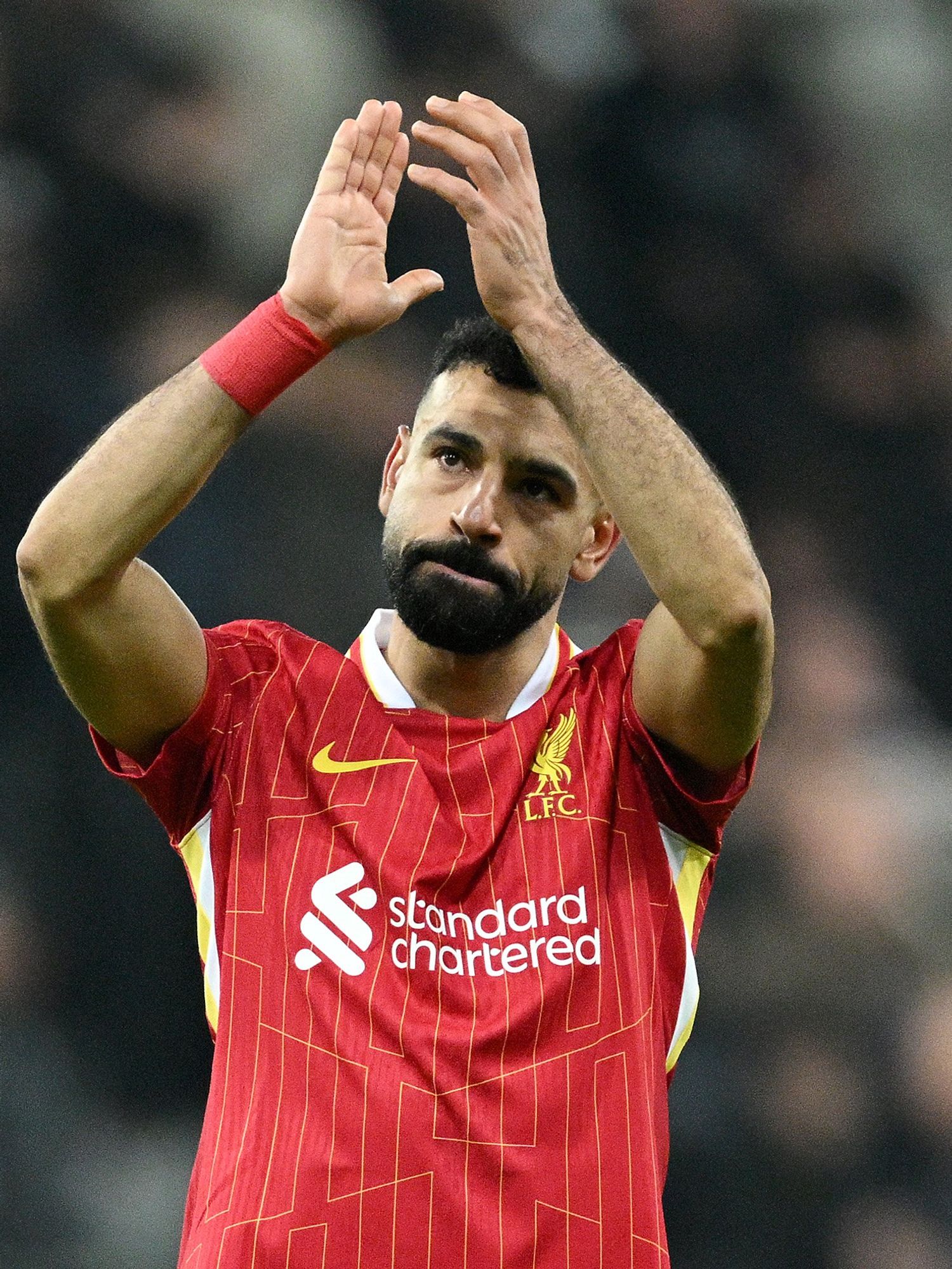Mohamed Salah of Liverpool applauds the fans after during the Premier League match between Newcastle United FC and Liverpool FC at St James' Park on December 04, 2024 in Newcastle upon Tyne, England