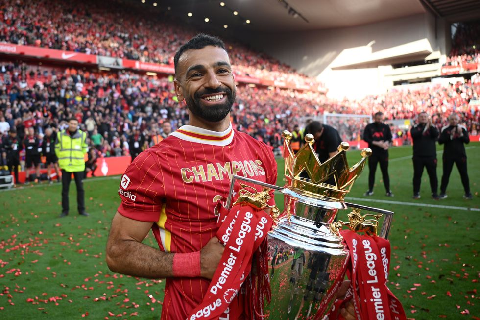 Mohamed Salah of Liverpool celebrates with the Premier League trophy trophy, as Liverpool are crowned the Champions of the Premier League for the 2024/25 Season
