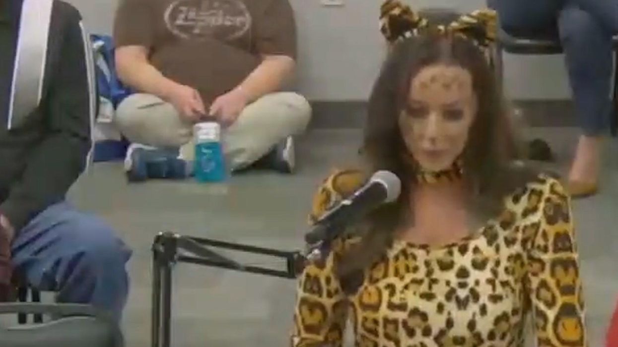 Mom dresses as giant cat at school board meeting to make offensive point