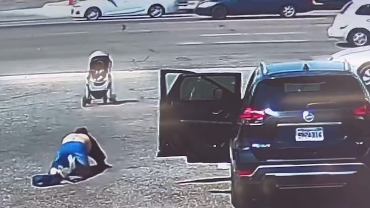 Moment hero stranger saves runaway pushchair heading for busy highway