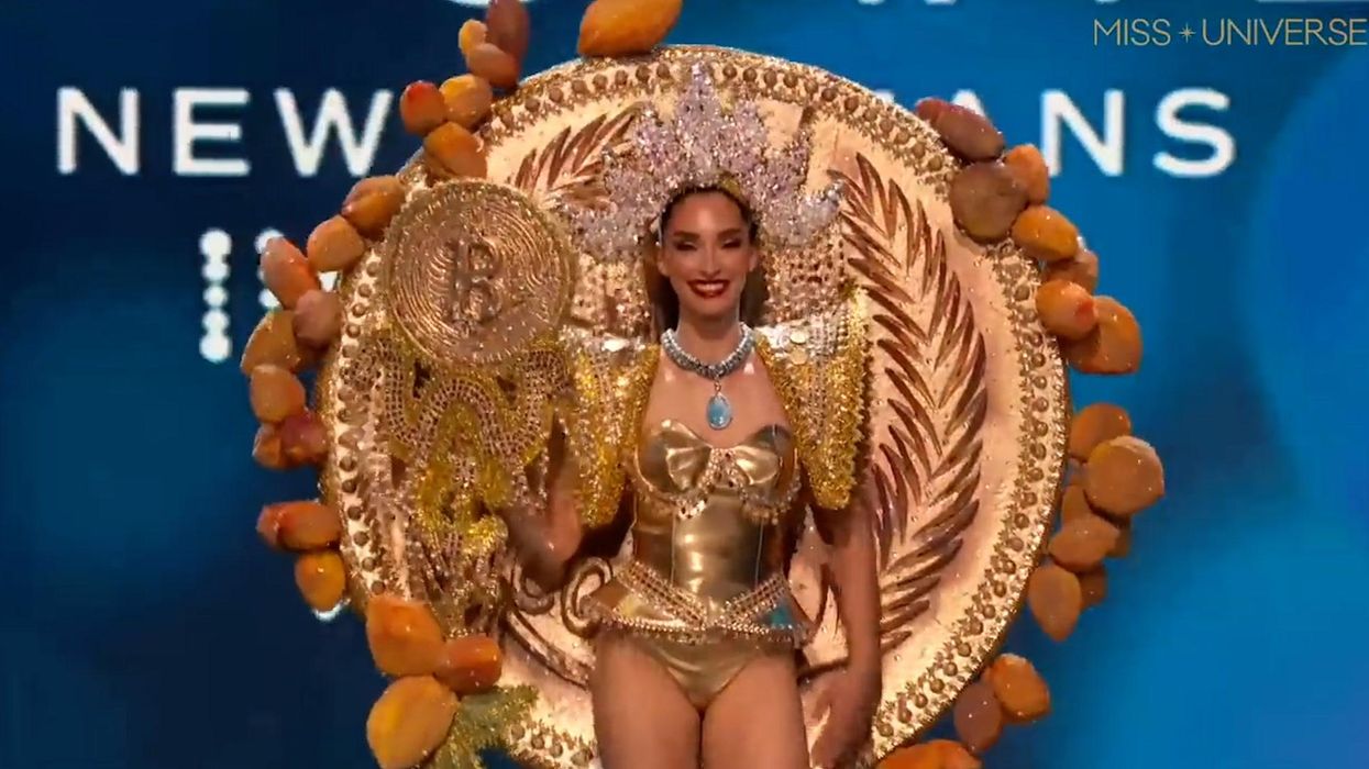 Bizarre moment Miss El Salvador appears on stage dressed as a giant Bitcoin