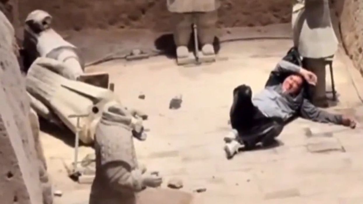 Tourist jumps into world famous ancient terracotta army in China