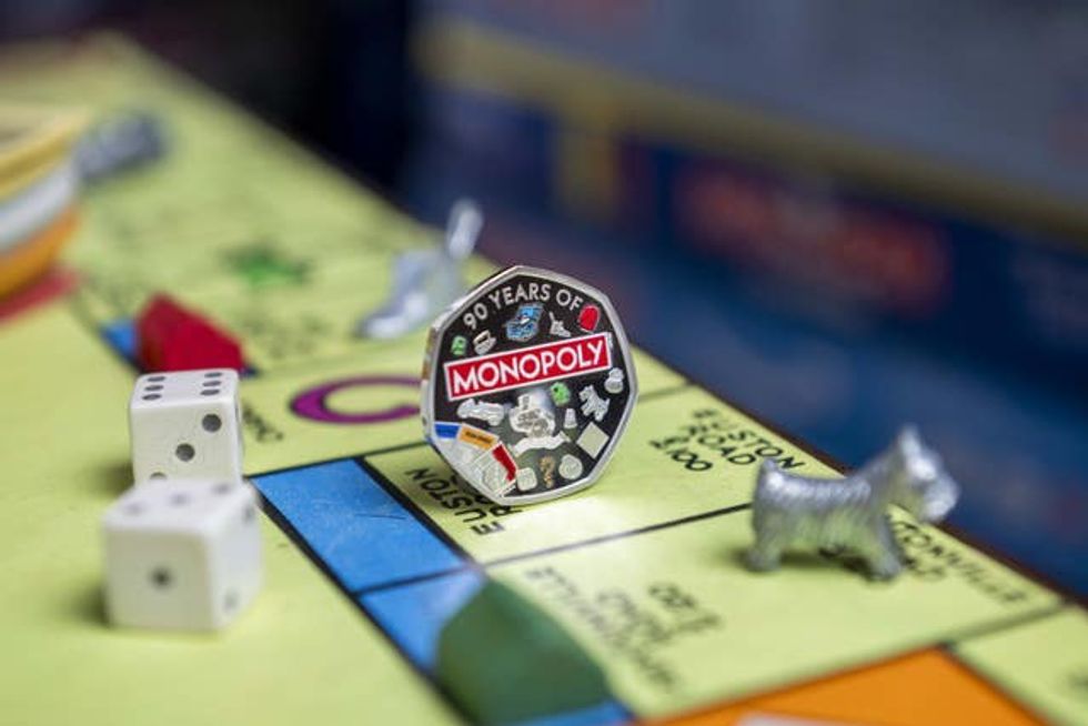 Monopoly 50p coin on a Monopoly board