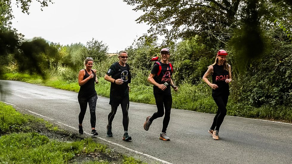 Mr Bagwell (second from left) has been joined by a series of different local runners on his journey (Matt Bagwell/Run The Country Ultra)