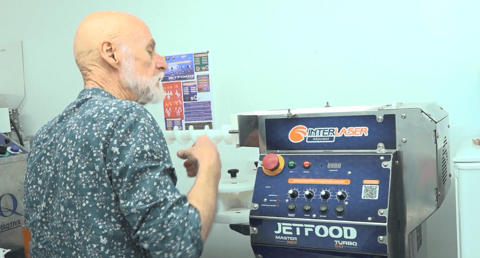 Mr Main using a cooking machine