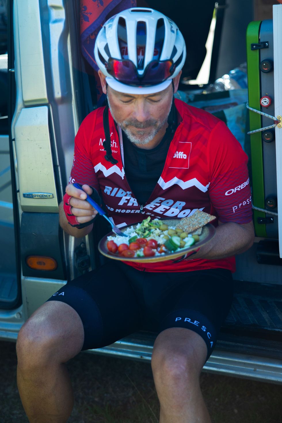 Mr Miller resting and fueling his body for the cycle (James Aubry/PA).
