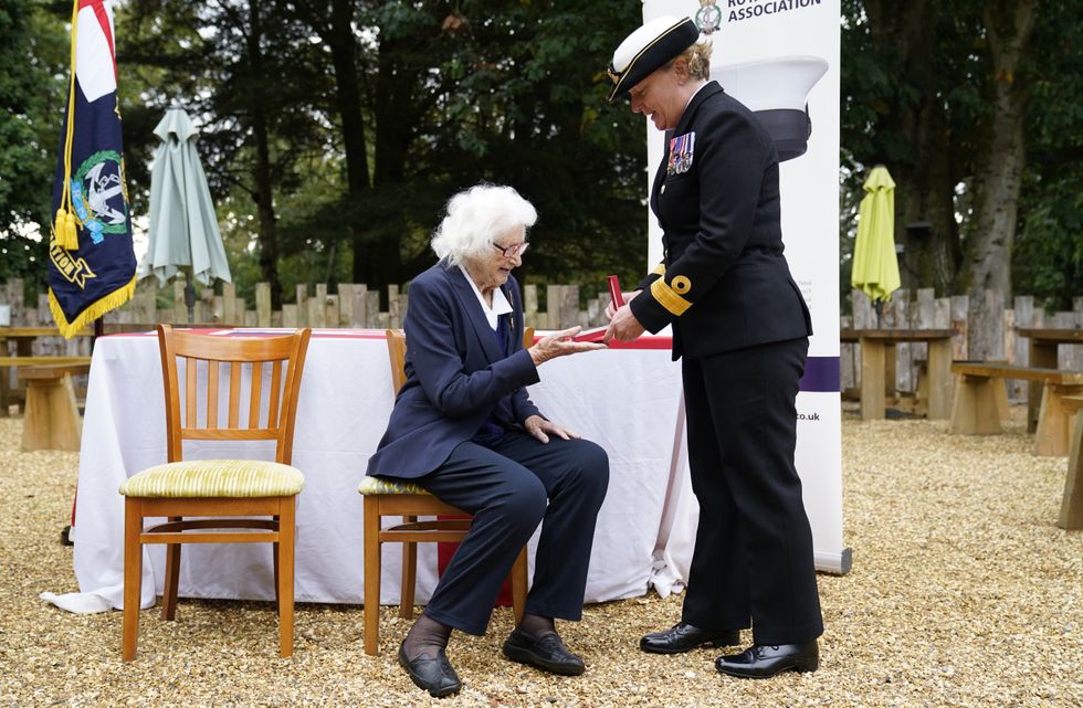 Mrs Cockayne receives the Legion d\u2019honneur from Royal Navy Commodore Judith \u2018Jude\u2019 Terry (Andrew Matthews/PA)