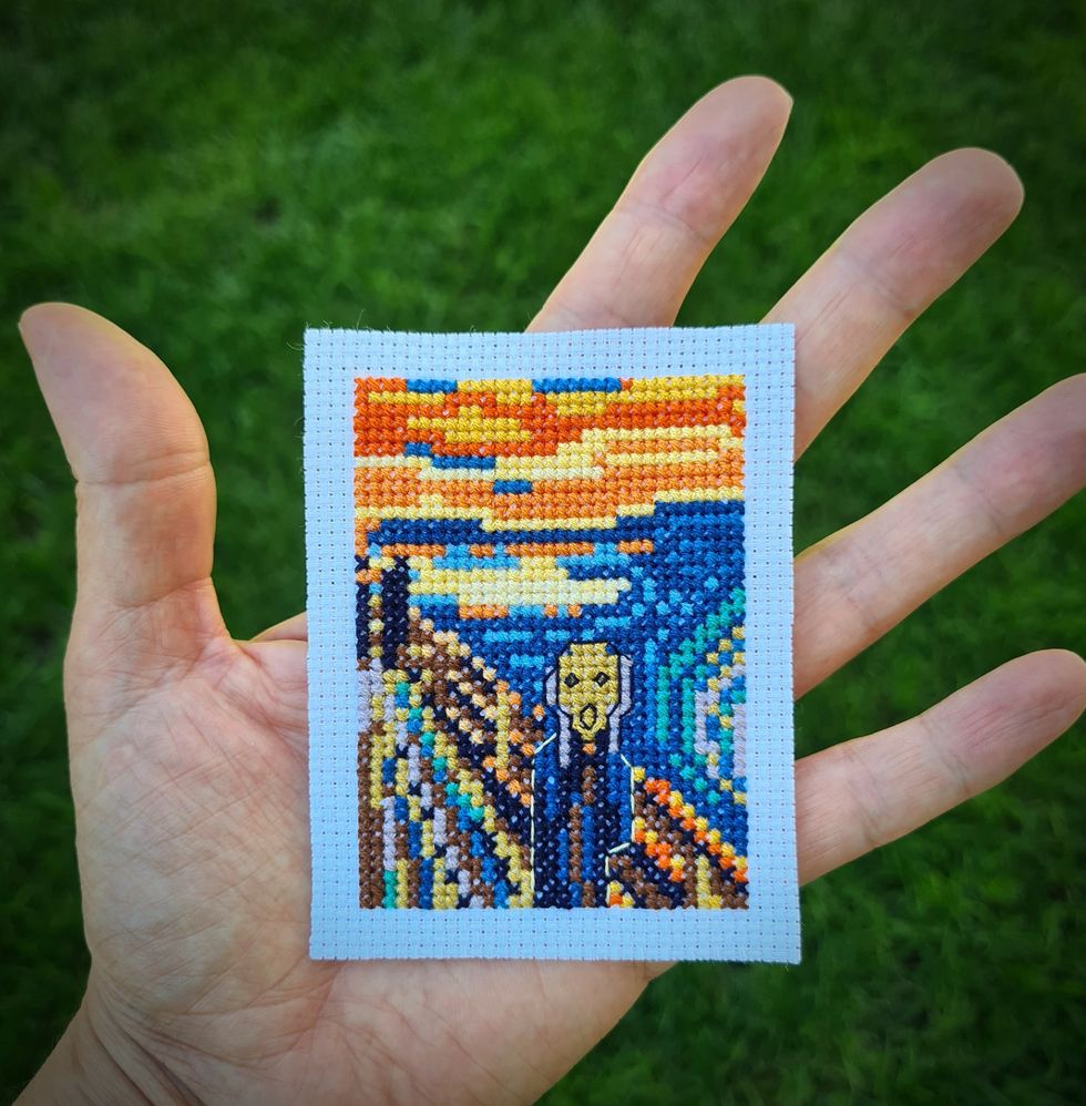 Mrs Ozcan holding her version of The Scream (Elcin Ozcan/PA).