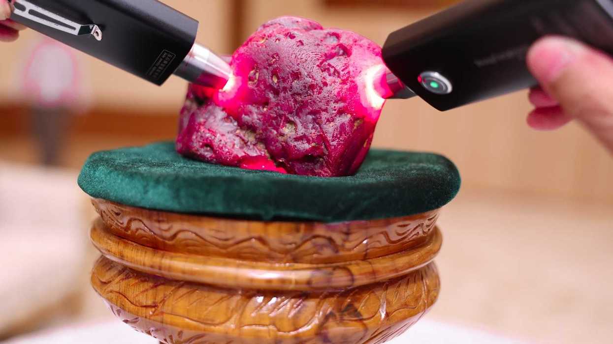 Myanmar officials inspect a newly discovered ruby