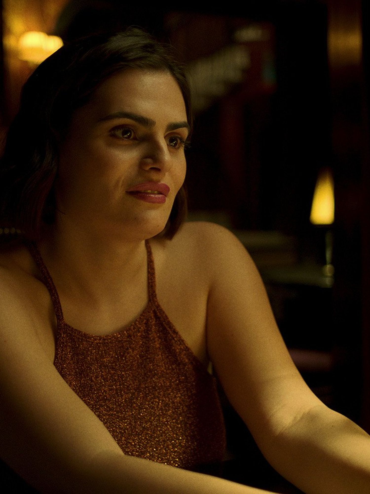 Nava Mau, a Mexican woman with long black hair and a brown dress, in Baby Reindeer.