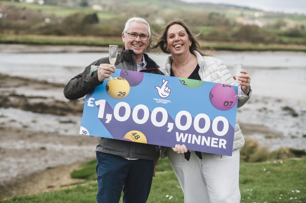 Neil and Sue Smart won \u00a31 million on the EuroMillions and buy a new family home (National Lottery/PA)