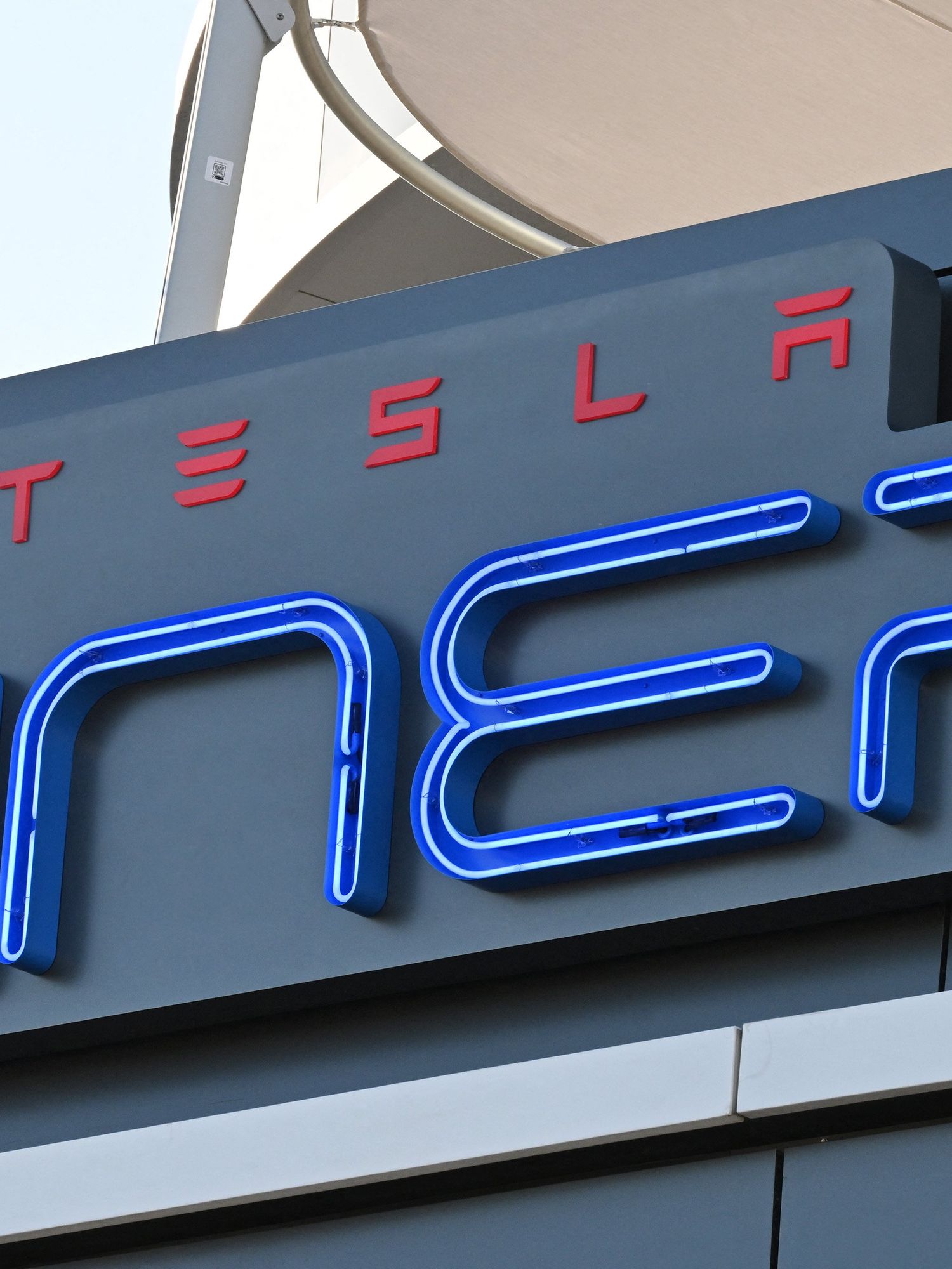 Neon signage which reads: 'Tesla diner'.