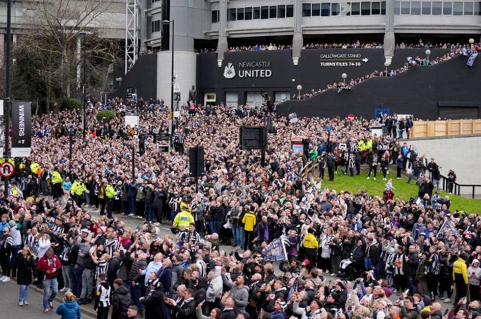 Newcastle United fans outside St James\u2019 Park, ahead of the Carabao Cup trophy parade in Newcastle