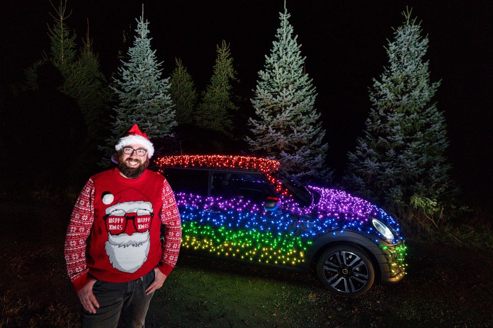 Nicholas \u2018Nico\u2019 Martin with the Mini Electric wrapped in thousands of Christmas fairy lights (Jacob King/PA)