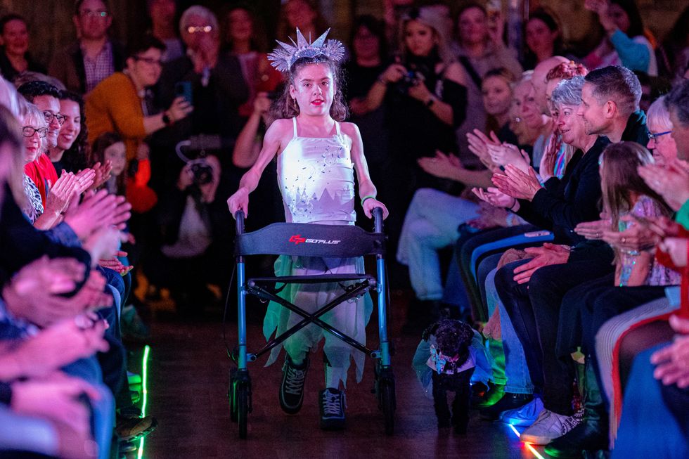 Girl with muscular dystrophy walks runway at Bristol Fashion Show
