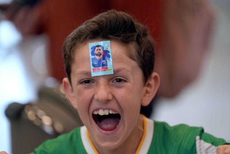 Nine-year-old Joe Cody waiting for the return of Cape Verde footballer Pico Lopes at Dublin Airport