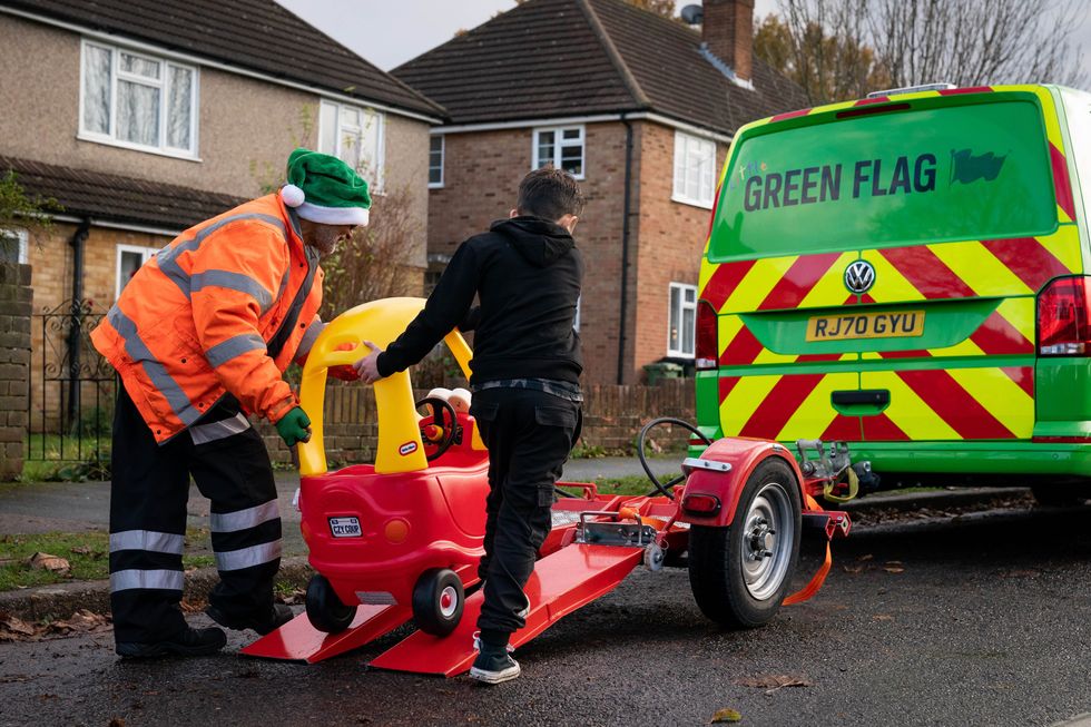 Noah Montenegro helps tow away his used Little Tike\u2019s Cozy Coupe to be recycled as part of the new Little Green Flag recovery service (Aaron Chown/PA Wire)