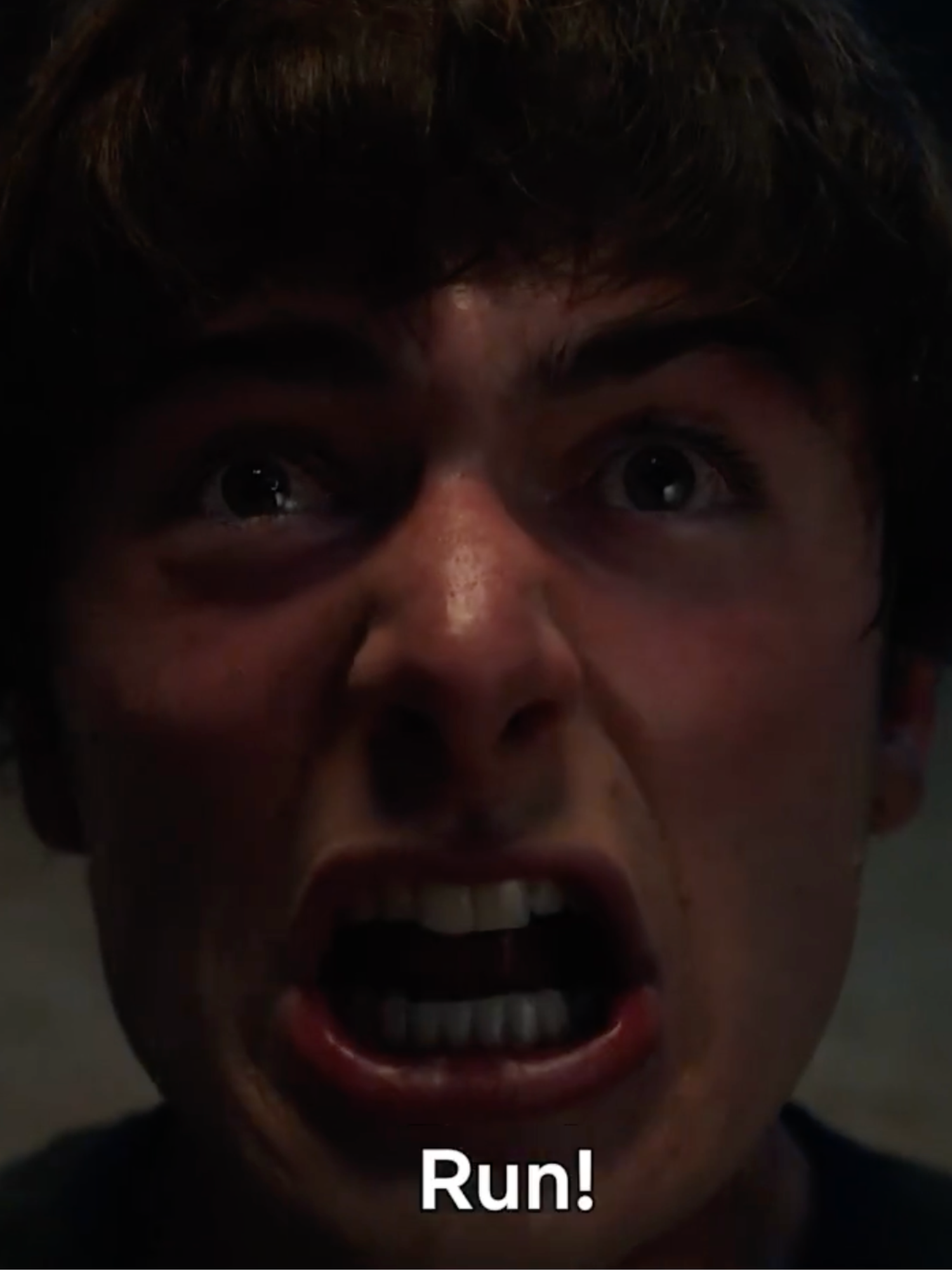 Noah Schnapp as Will Byers in Stranger Things, yelling 'run'.