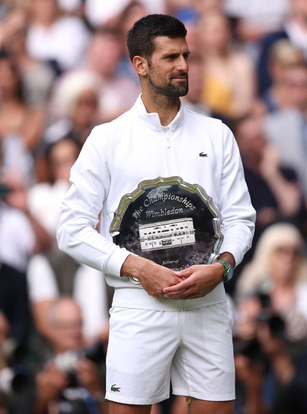 Novak Djokovic holding the runners up trophy