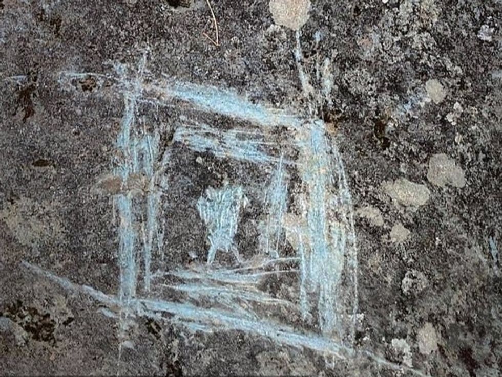 Numerous boulders in the track rock gap had damages, including five that had large scratches and carvings and two that had paint all over them.