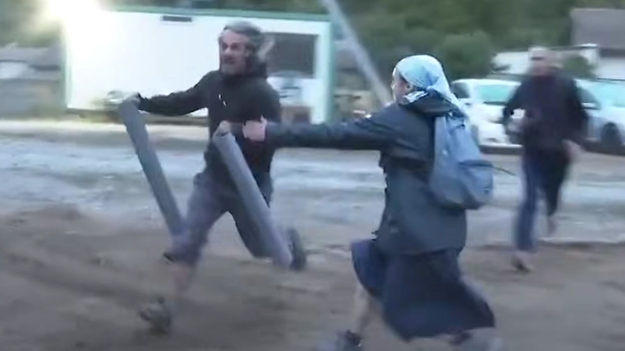 Nun tackles climate protester into mud for trying to block building of pilgrim centre
