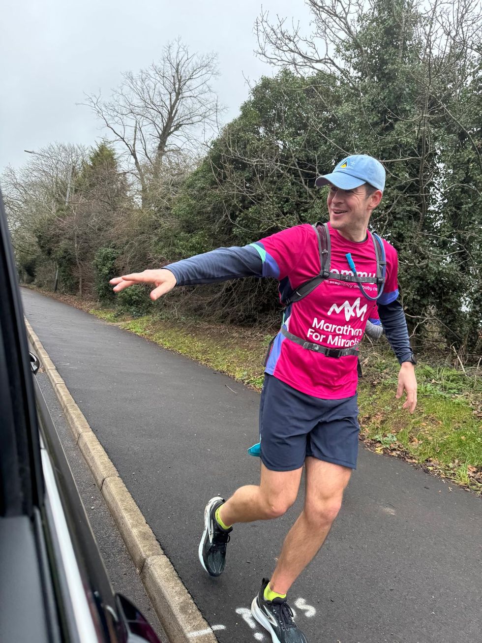 Olly Brown gestures while running