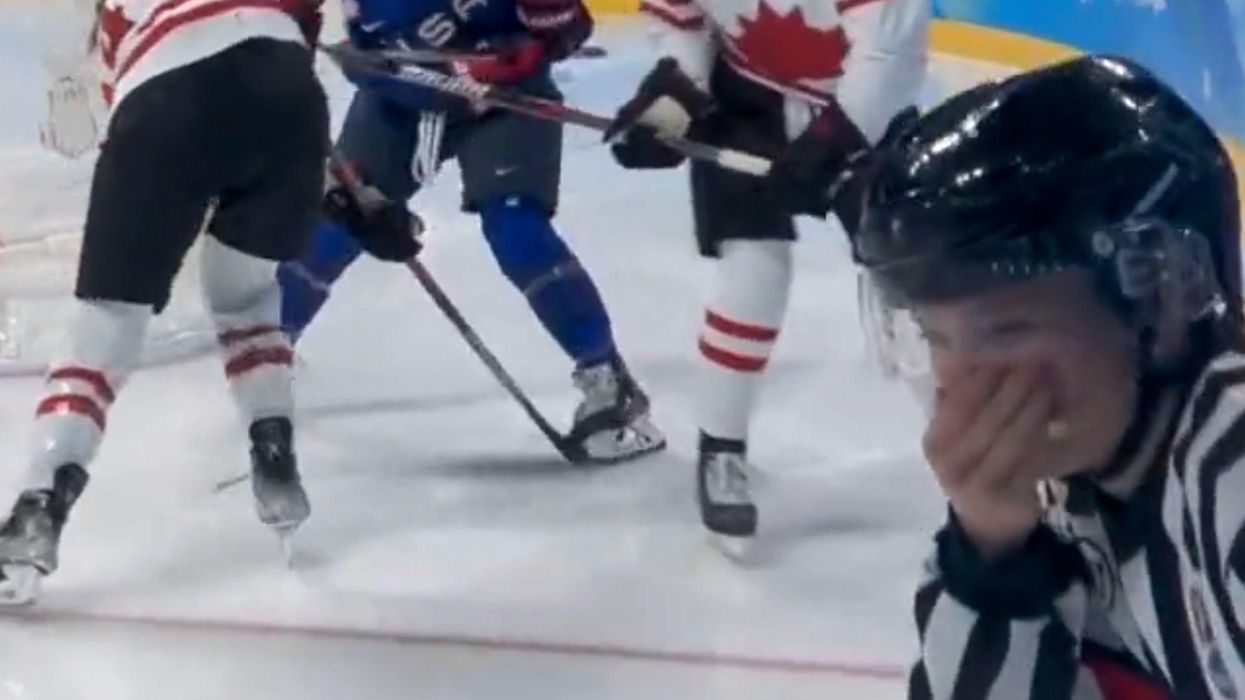Olympic ice hockey referee left with bloody face after getting hit by stick - and returns to officiate game