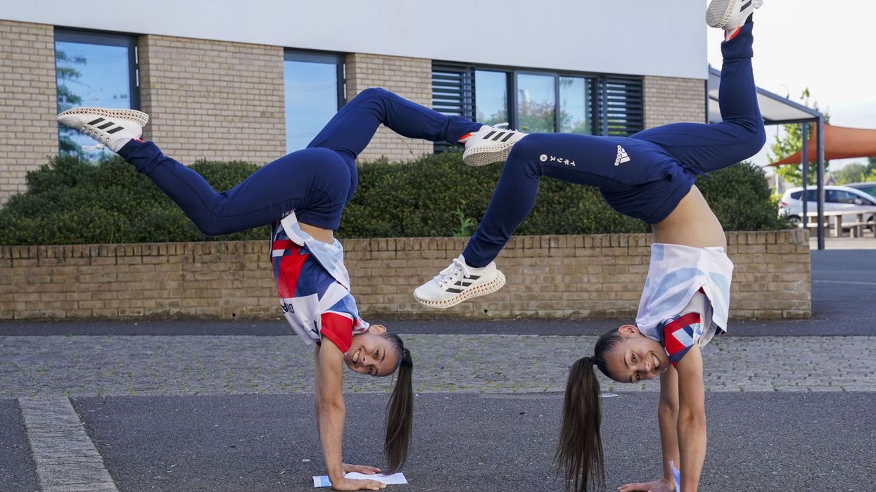 Olympic medal winning twins Jessica (left) and Jennifer Gadirova celebrate their GCSE results at Aylesbury Vale Academy in Buckinghamshire (Steve Parsons/PA)
