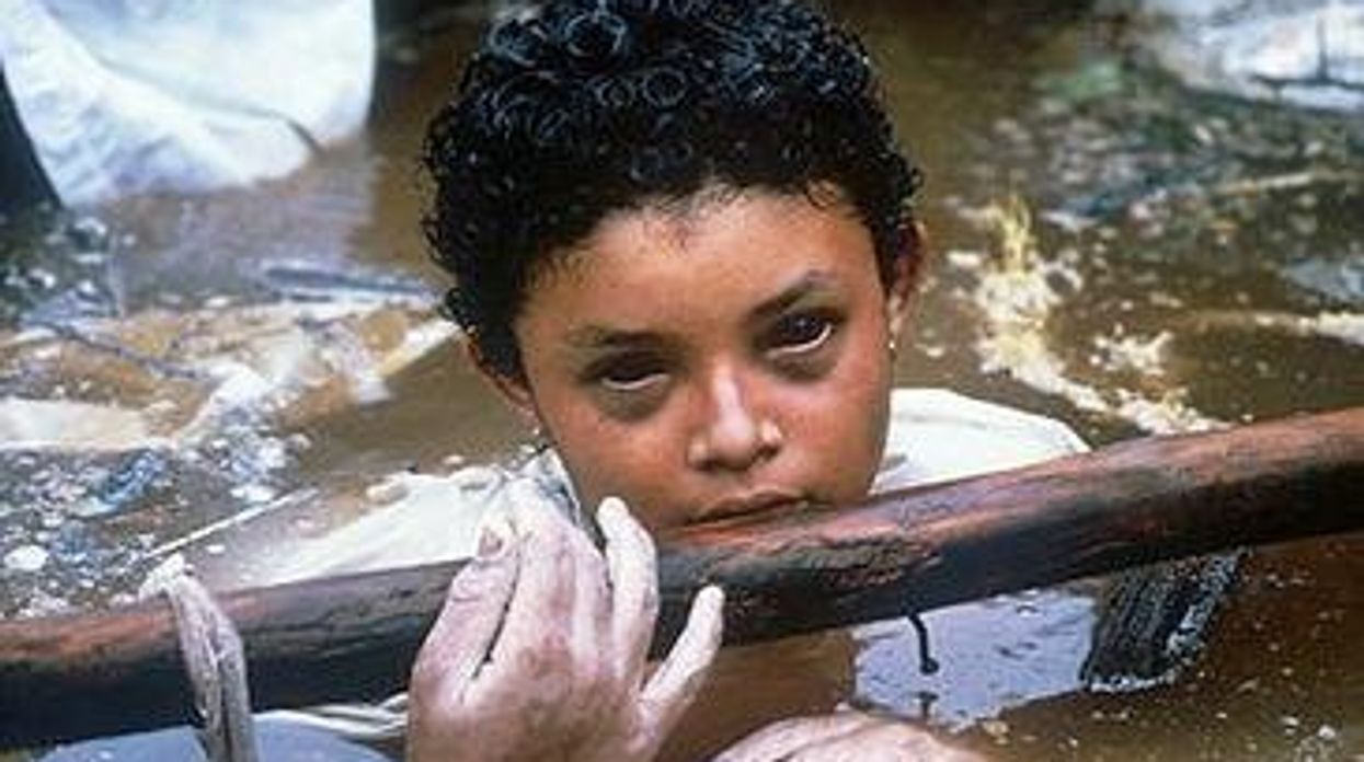 Omayra Sánchez Garzón half-buried in muddy water as captured by Frank Fournier in 1985