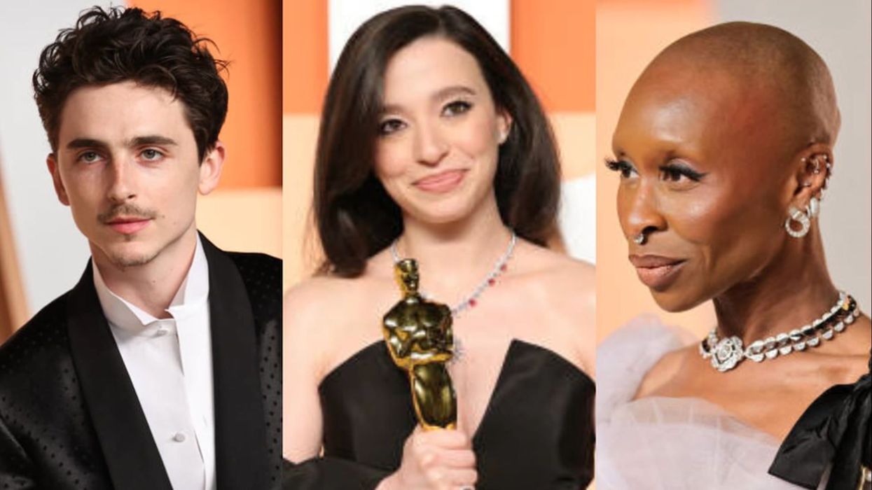 Wicked star spotted browsing own red carpet pics at the Oscars - and everyone's saying same thing